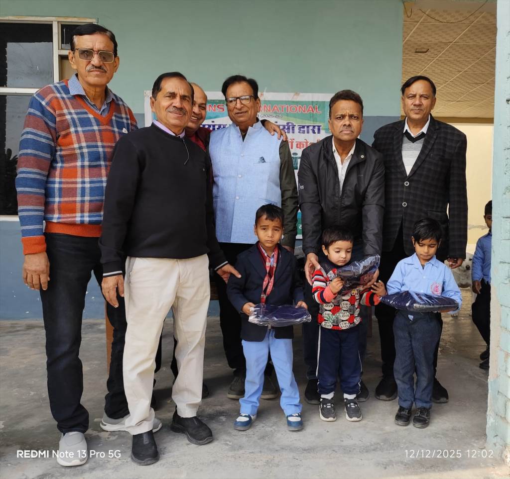 Lions Club Hansi distributes sweaters to needy children